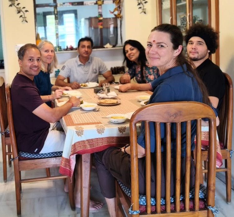 students having meals with host family in jaipur